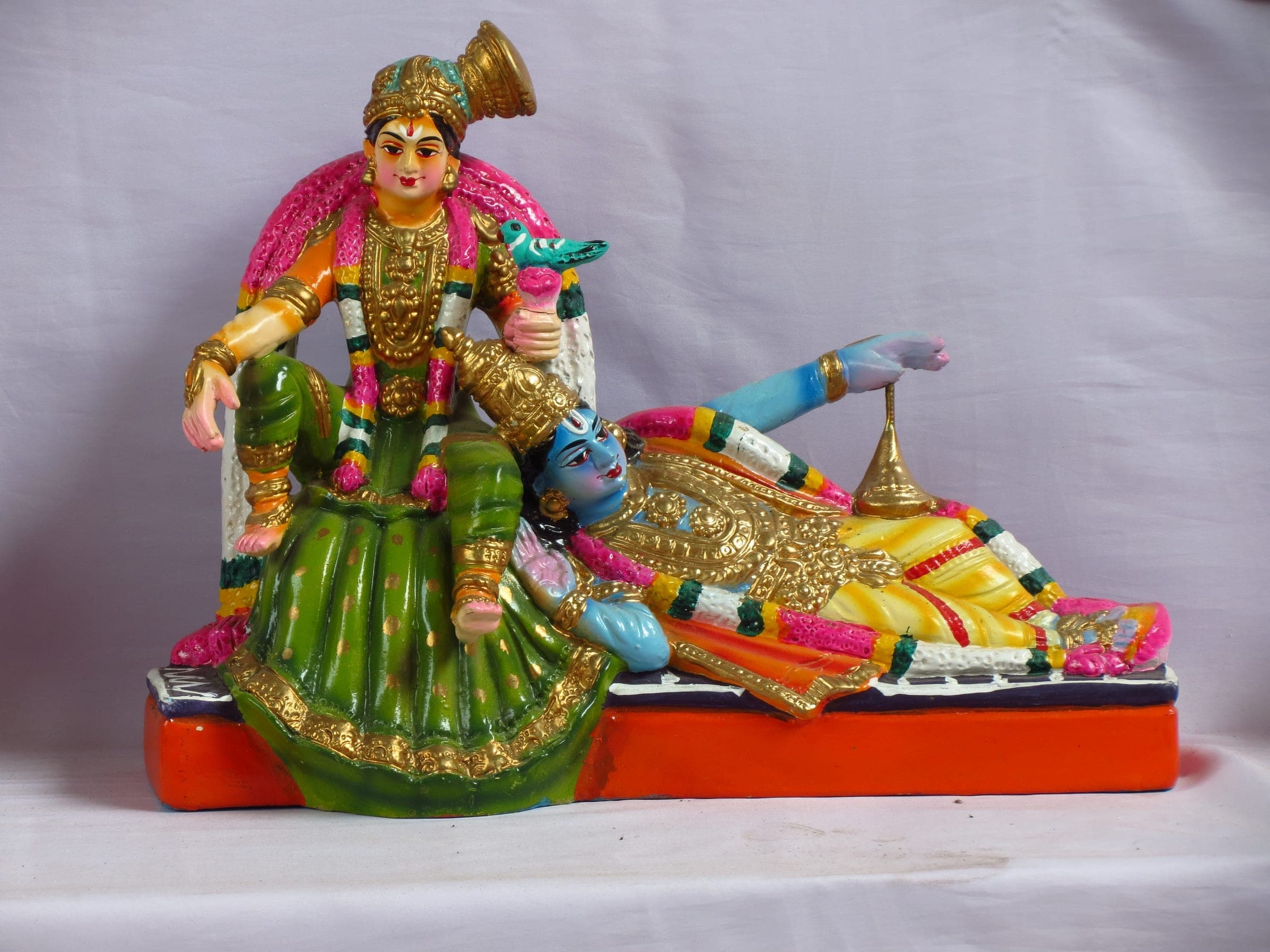 Sri Andal, the woman among the twelve Alvars, with Bhagavan Sri Krishna's head resting on her lap, in a household Tamil Golu display